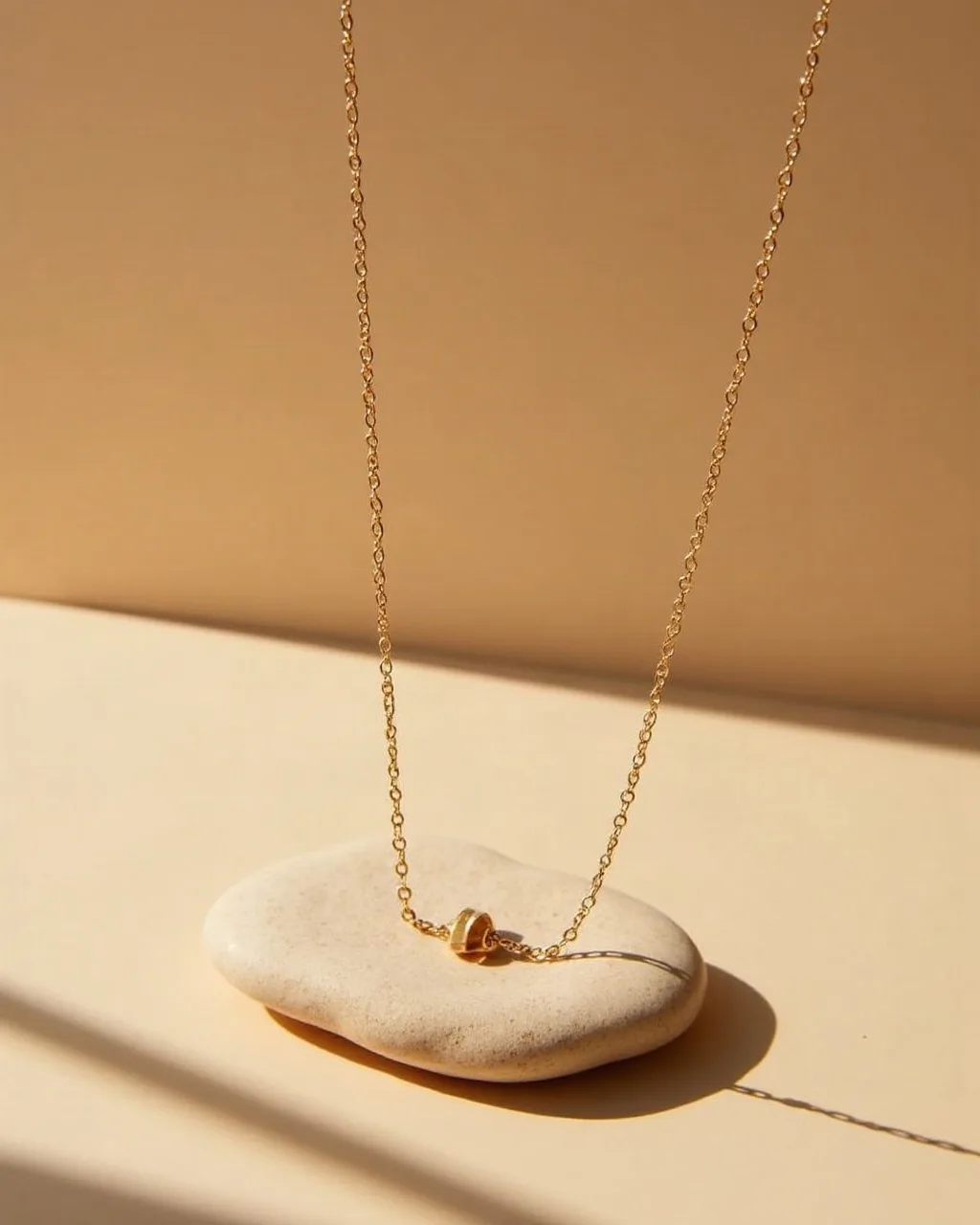 Fine necklace laid on natural stone, suited to a camera orbit