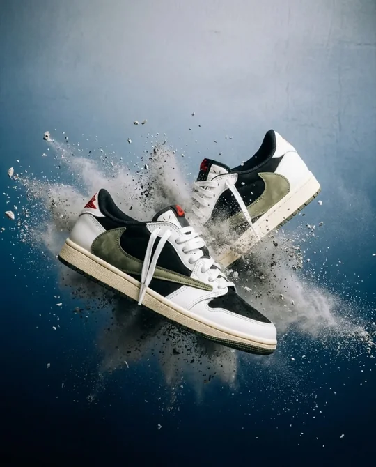 Sneaker ad variation: two sneakers bursting out of a dust cloud